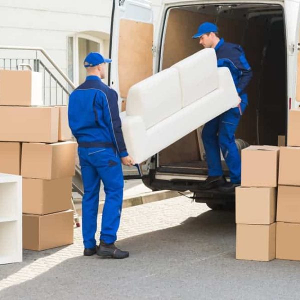 Movers Unloading Sofa — Removals & General Freight in Port Macquarie, NSW