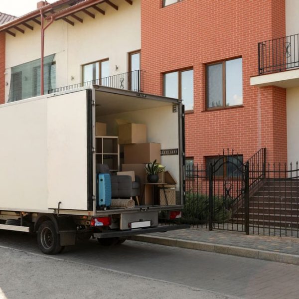 White Truck With Furniture And Moving Boxes